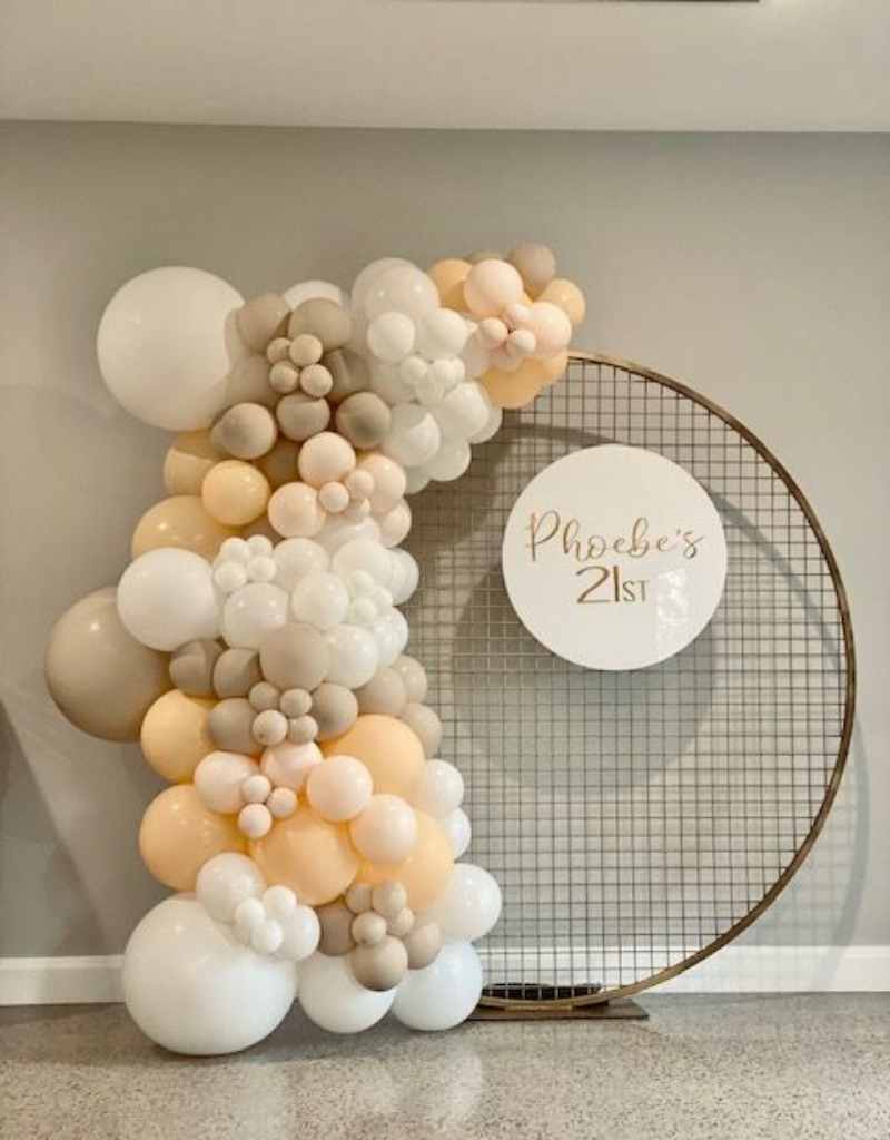 Gold Mesh Backdrop with Beige Balloons for Hire in Newcastle NSW