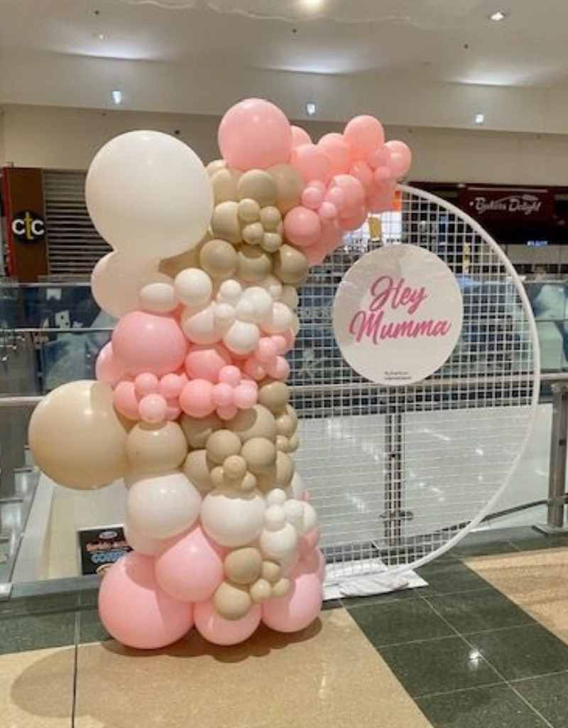 White Mesh Backdrop with Beige and Pink Balloons for Hire in Newcastle NSW